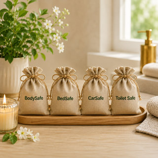 Home Protection Kit - BodySafe, BedSafe, CarSafe, and Toilet Safe crystal pouches styled on a wooden tray with candle and jasmine flowers