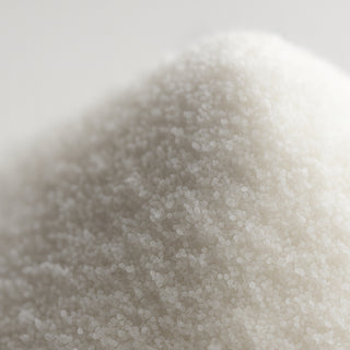 Close-up macro shot of natural diamond powder showing individual crystalline grains and texture