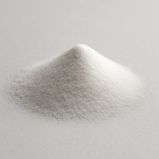 Natural diamond powder heaped on white background, side angle view showing fine crystalline texture