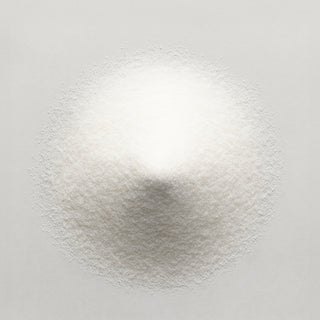 Natural diamond powder pile viewed from top, fine white crystalline grains
Title: Diamond Powder - Top View