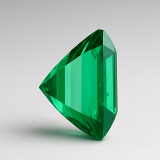 Natural emerald (Panna) gemstone, faceted trillion cut, front angle view
Title: Natural Emerald (Panna) Gemstone - Front View