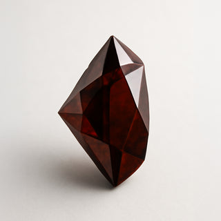 Natural garnet (Gomed) gemstone, faceted pear cut, front angle view
Title: Natural Garnet (Gomed) Gemstone - Front View