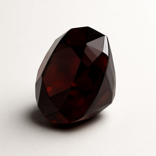 Natural garnet (Gomed) gemstone, faceted oval cut, alternate angle view
Title: Natural Garnet (Gomed) Gemstone - Side View