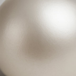 Close-up of natural white pearl (Moti) gemstone showing lustrous surface texture