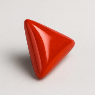 Natural red coral (Moonga) gemstone, smooth triangular cabochon, front angle view