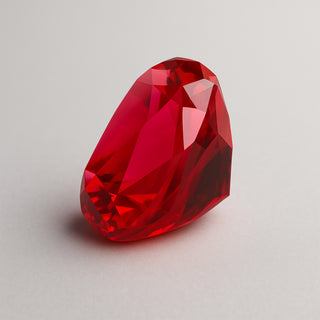 Natural ruby (Manik) gemstone, faceted pear cut, front angle view
Title: Natural Ruby (Manik) Gemstone - Front View