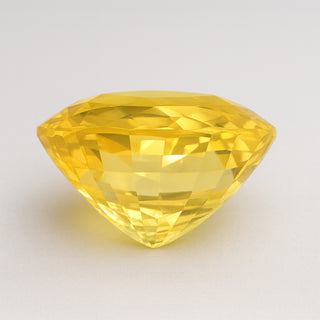 Natural yellow sapphire (Pukhraj) gemstone, faceted round cut, alternate angle view
